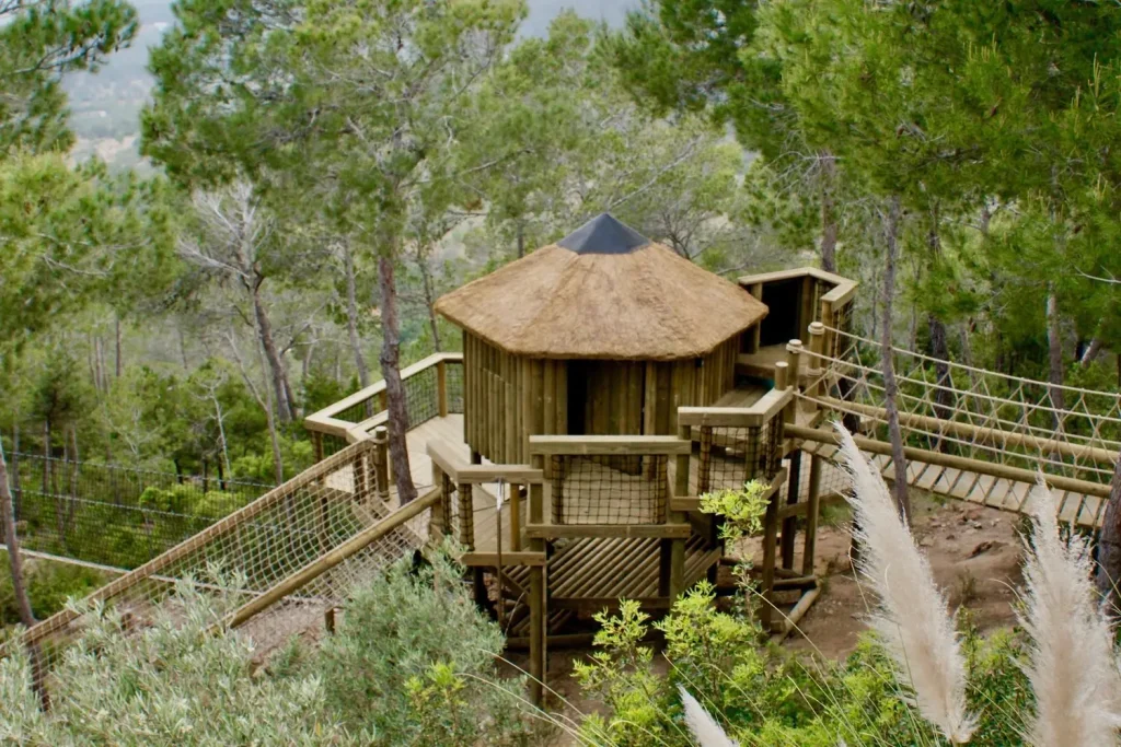 Treehouse with multi-level decks on a hillside in Ibiza - "Best Bespoke Tree-House Builders, 2021" - Awarded to Treehouse Life Ltd. by LUX Magazine, Travel & Tourism Awards
