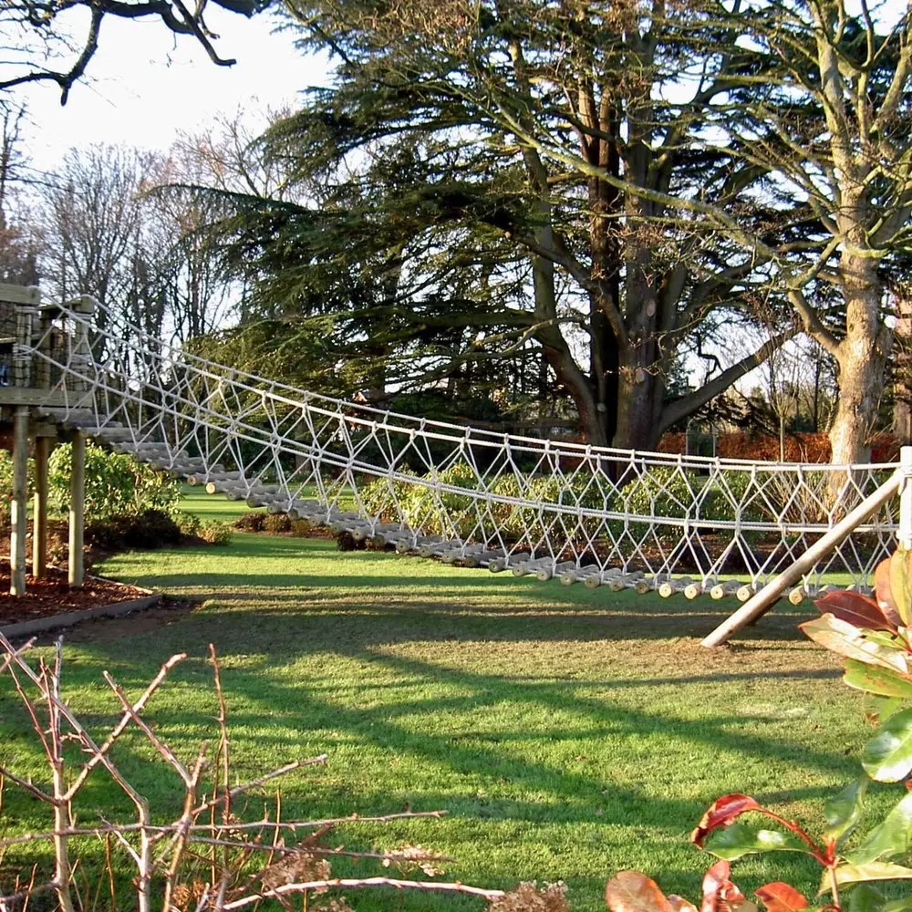 Garden Log Rope Bridge leading from lawn to Treehouse.