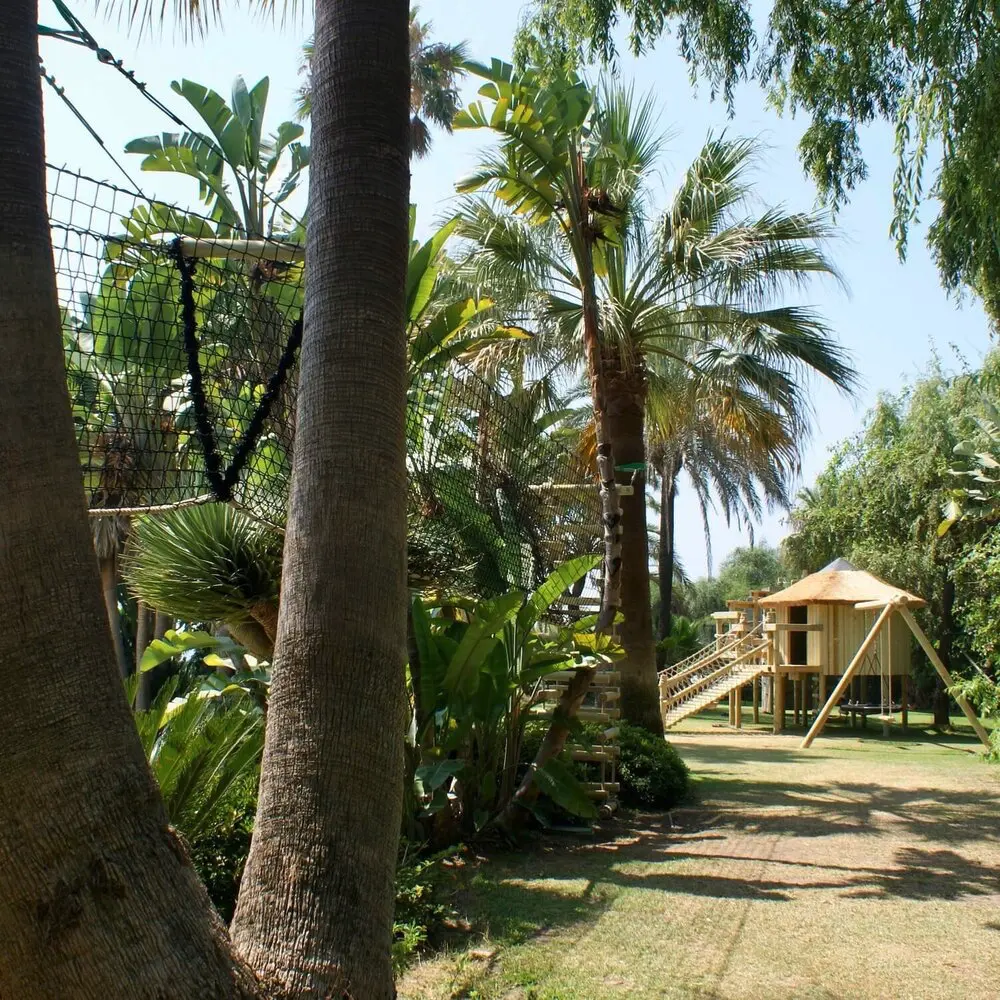 Family garden adventure Treehouse set into a French Riviera garden setting amongst palm trees.