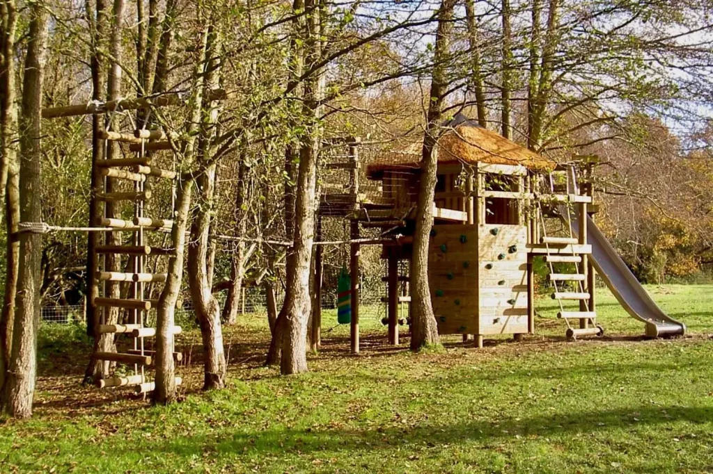 Garden Treehouse plus Rope Ladder, Slide, Decks and Platforms, Treetop Walkway and Big Rope Ladder, all set in woodland trees.