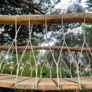 Fixed Beam Rope Bridge with a beam of Robinia hardwood running through the rope work balustrade.