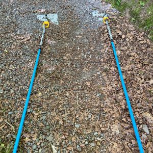 Ground Anchor plates with Swivel Loads Rings, Rigging Screws and cable covered in protective blue pipe.