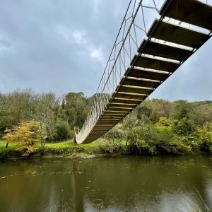 Rope Bridge spanning the River Tamar AONB with timber slats and structural rope.