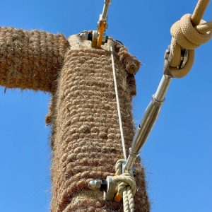 Structural rope attached to stainless steel Rigging Screws attached to Swivel Load Rings and structural rope covered steel section.
