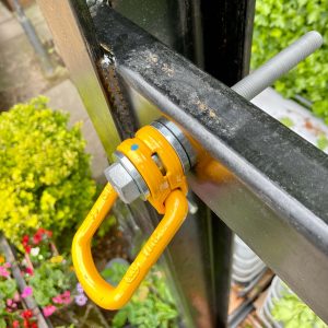 Swivel Load Ring anchor installed through steel box section.